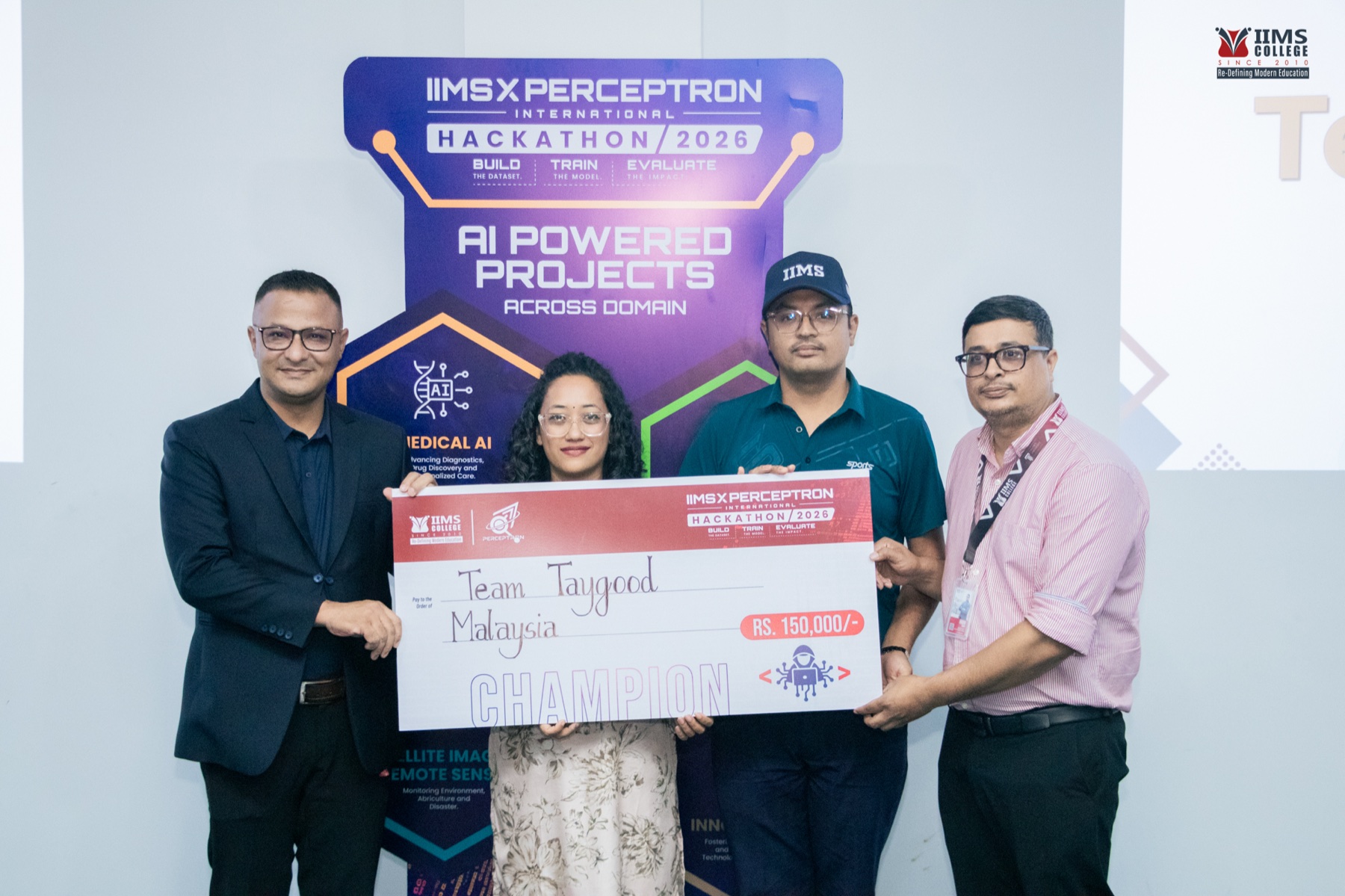 Team Taygood holding the champion cheque at the awards ceremony