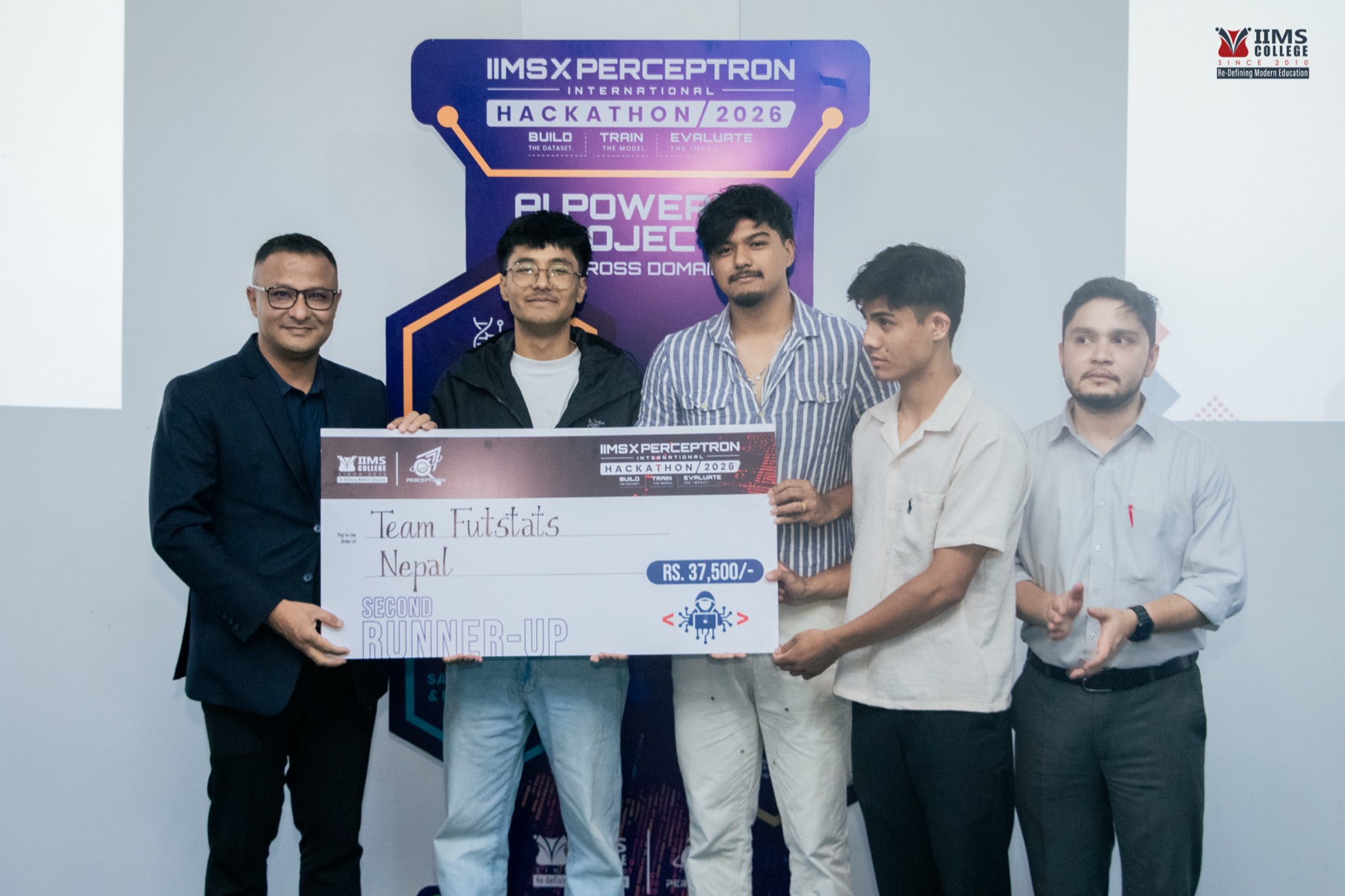 Team FutStats holding the second runner-up cheque